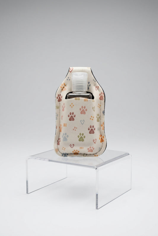 Cream Paws and Hearts hand sanitizer holder with refillable bottle