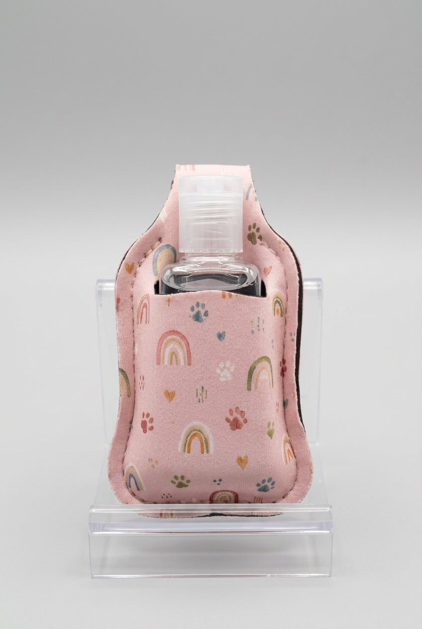 Pink Rainbows and Paws hand sanitizer holder with refillable bottle