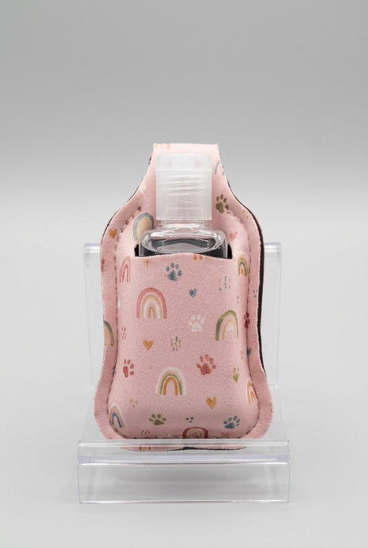 Pink Rainbows and Paws hand sanitizer holder with refillable bottle