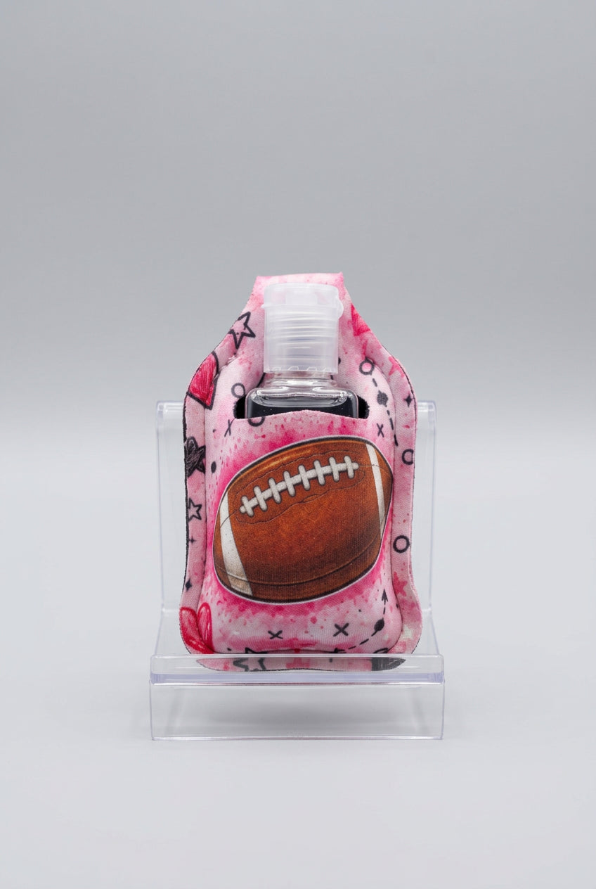 Pink Football hand sanitizer holder with refillable bottle